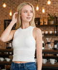 woman wearing seamless crop tank top with built in bra styled with jeans for casual summer outfit