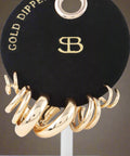 Close-up of gold-tone 1 inch hoop earrings from earring set