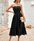 Black strapless smocked midi dress styled for summer outing