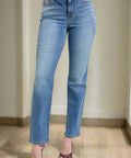 Front close-up of mid rise stretch straight jeans with subtle fading

