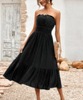 Back view of black midi dress with smocked bodice
