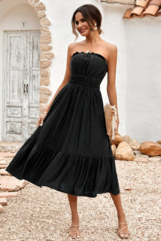 Back view of black midi dress with smocked bodice