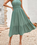 Sage green strapless midi dress flowing with movement