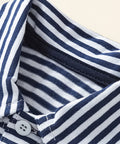 close up of boys striped cotton polo shirt collar and button placket
