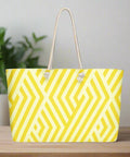 Front view of oversized yellow and white geometric print weekender tote bag with rope handles