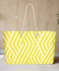 Yellow geometric weekender tote bag displayed in a modern styled room on light wood