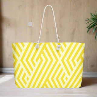 Yellow geometric weekender tote bag displayed in a modern styled room on light wood