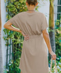 Back view of taupe A-line dress with waist tie