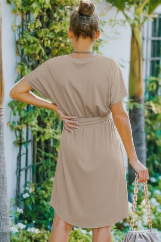Back view of taupe A-line dress with waist tie