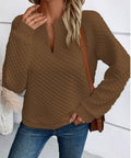 Angled view of a brown textured notched neckline sweatshirt for women