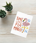 Time to Flamingle card on white wooden table with succulent plant
