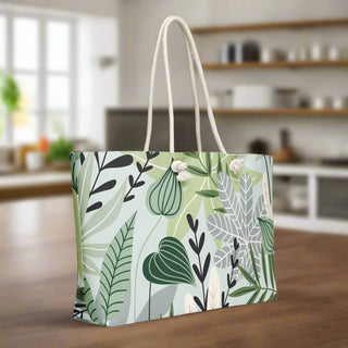  Green leaf print weekender tote bag with rope handles shown from side angle