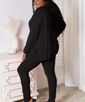 Model in a black V-neck lounge set, paired with casual sandals for a relaxed, everyday look.