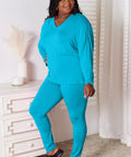 Side view of the blue lounge set, highlighting the smooth, lightweight fabric and relaxed fit.
