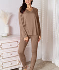 Neutral-toned brown V-neck lounge set, styled with white sneakers for an effortless look.