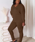  Model in a brown two-piece lounge set, styled for cozy everyday wear.