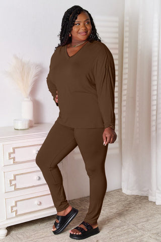  Model in a brown two-piece lounge set, styled for cozy everyday wear.