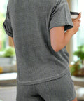 Back view of a grey waffle-knit lounge set, highlighting the soft textured fabric and casual design.