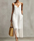 woman wearing white fringe hem maxi dress styled for beach vacation outfit