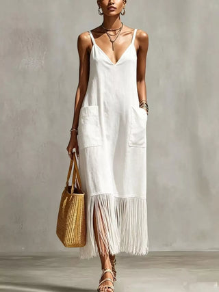woman wearing white fringe hem maxi dress styled for beach vacation outfit