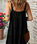 Back of flowy sleeveless mini sun dress with wide straps