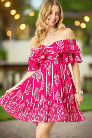 Full body view of pink off-shoulder dress with ruffle sleeves, lightweight fabric