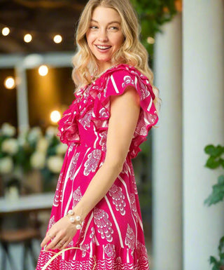 Side view of women’s hot pink mini dress with off-shoulder neckline and flared skirt